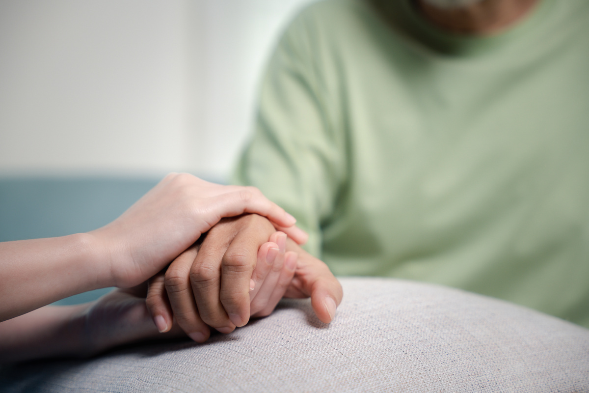 Caring Nurse Helping Elderly Old Man Care Facility Gets Help